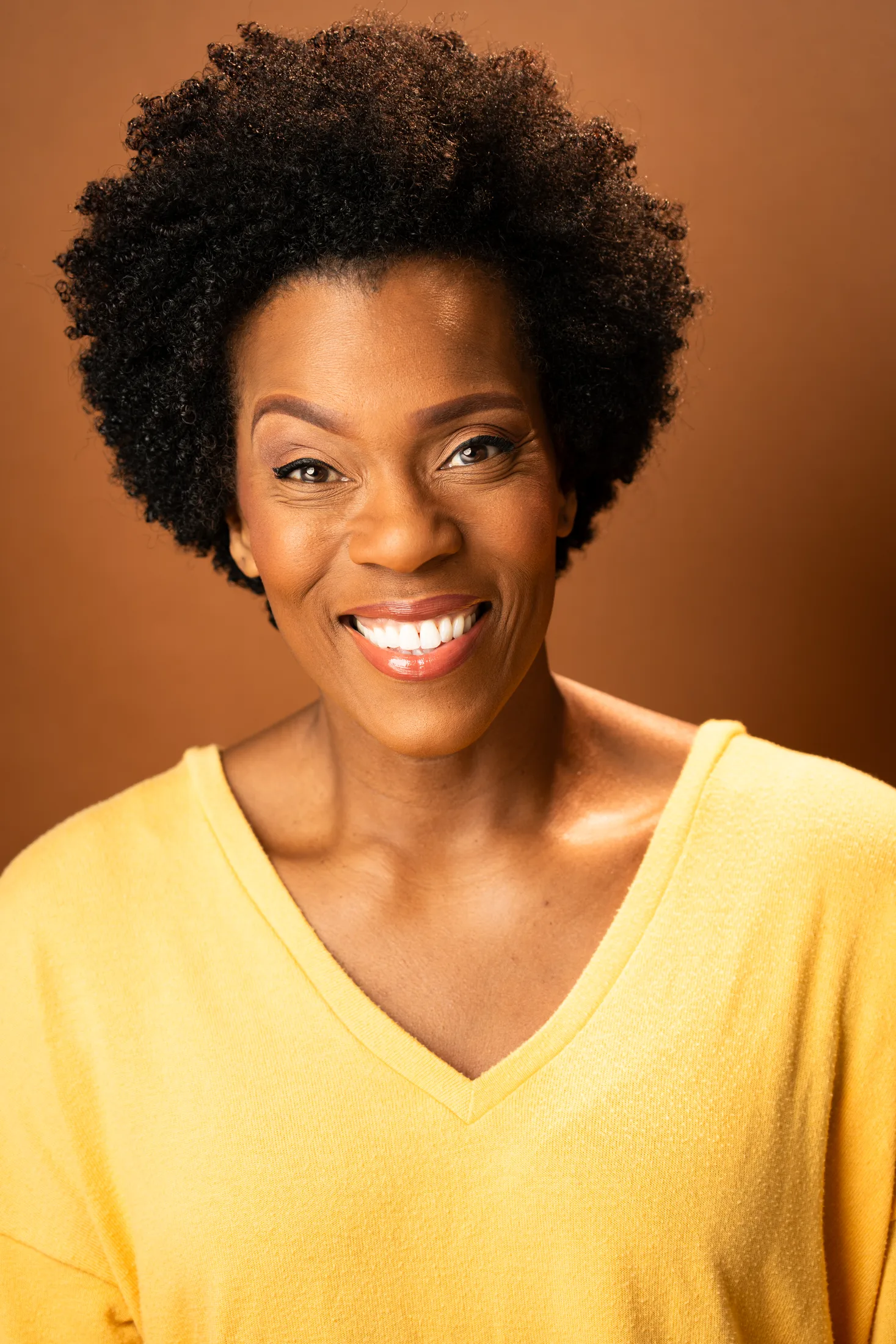 Patrece Bloomfield smiling in a yellow top
